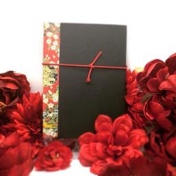 Black cover with red string